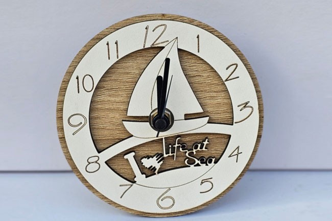 Bomboniera orologio vela, bomboniera solidale per battesimo e comunione